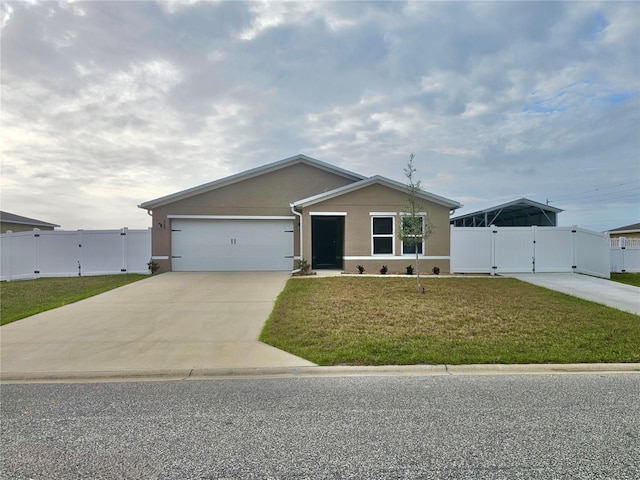 view of front of house with concrete driveway, an attached garage, a gate, a front yard, and stucco siding