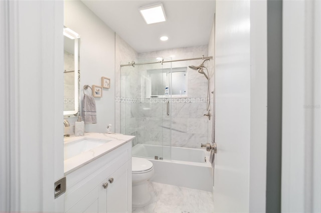 full bath featuring toilet, enclosed tub / shower combo, and vanity