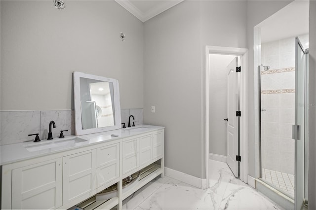 full bath featuring marble finish floor, double vanity, a sink, and crown molding