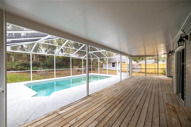 outdoor pool featuring a lanai and a fenced backyard