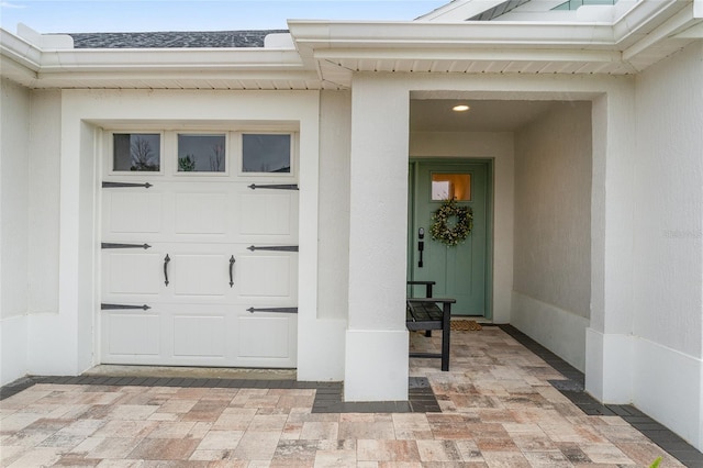 doorway to property with stucco siding