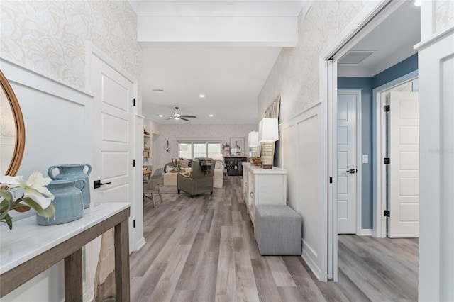 entrance foyer with wallpapered walls, light wood-style flooring, and ceiling fan