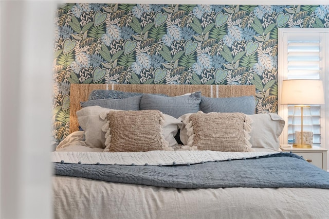 bedroom featuring wallpapered walls