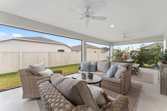 view of patio / terrace with an outdoor hangout area, outdoor dining area, a fenced backyard, and a ceiling fan