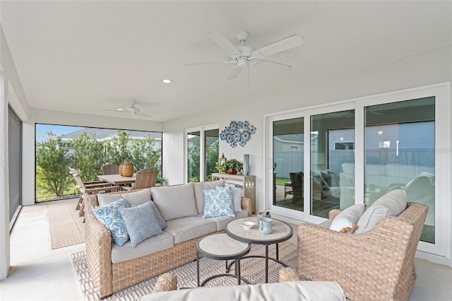 sunroom with a ceiling fan