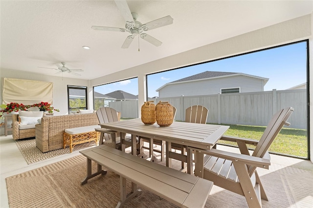 sunroom with ceiling fan