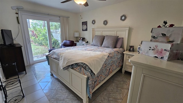 bedroom featuring light tile patterned floors, access to outside, and a ceiling fan