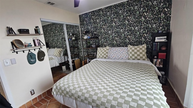 bedroom featuring visible vents and a ceiling fan