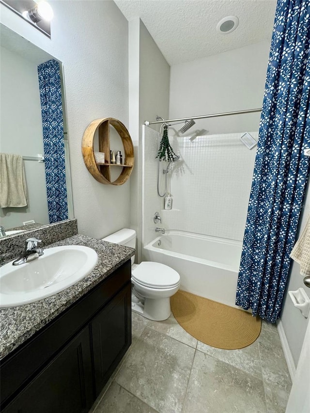 bathroom featuring toilet, shower / bathtub combination with curtain, a textured ceiling, and vanity