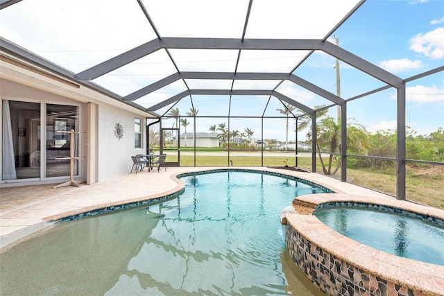 view of swimming pool with glass enclosure, a pool with connected hot tub, a patio area, and a lawn