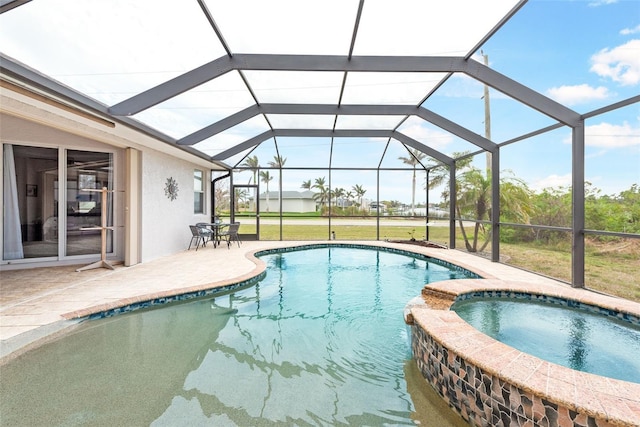 view of pool with a patio area, a lawn, glass enclosure, and a pool with connected hot tub
