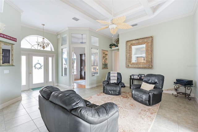 living area with crown molding, light tile patterned floors, baseboards, beam ceiling, and visible vents