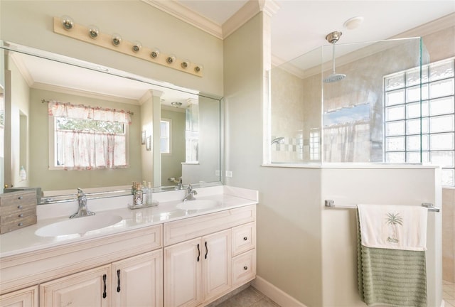 bathroom featuring double vanity, walk in shower, crown molding, and a sink