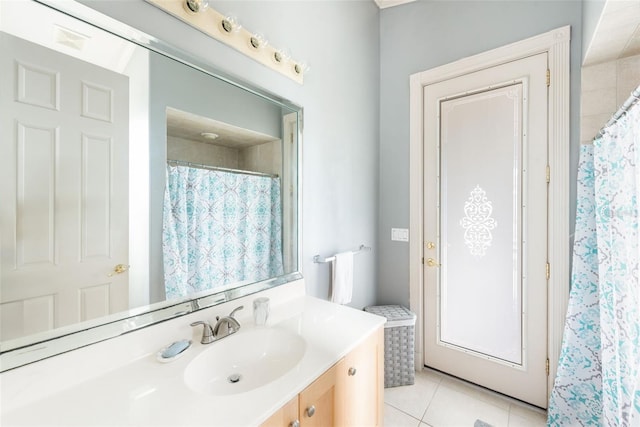 full bath featuring a shower with curtain, vanity, and tile patterned floors