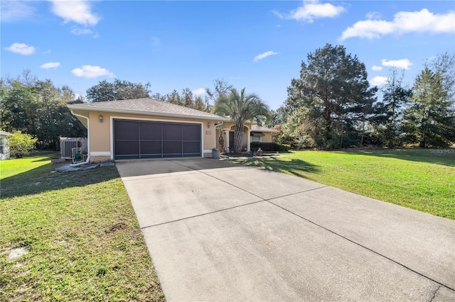 ranch-style home featuring an attached garage, driveway, a front yard, and stucco siding