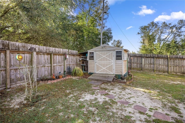 view of shed featuring a fenced backyard