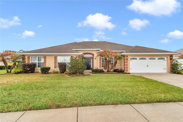 ranch-style home featuring a garage, stucco siding, concrete driveway, and a front yard