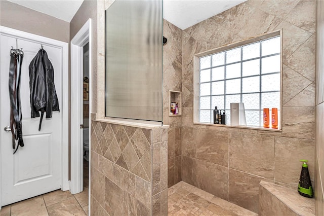 bathroom featuring toilet and walk in shower