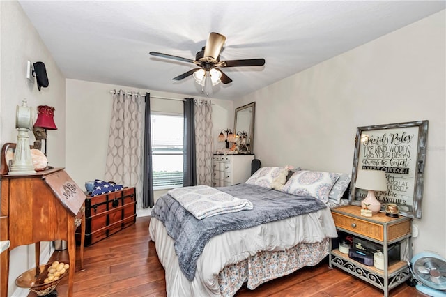 bedroom with dark wood-style flooring and ceiling fan