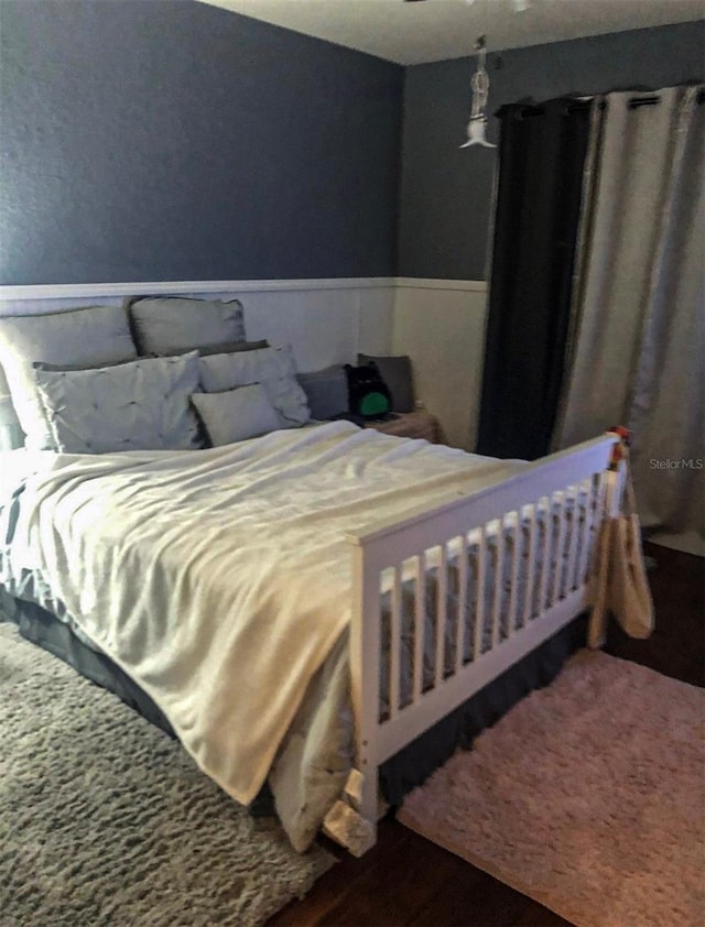 bedroom with wainscoting