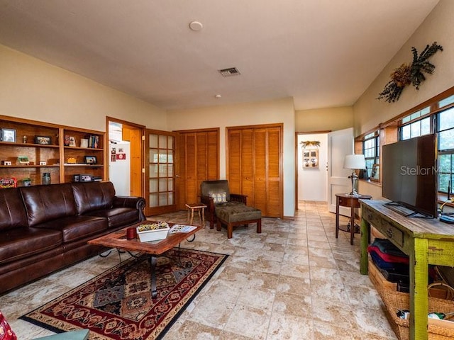 living room featuring visible vents