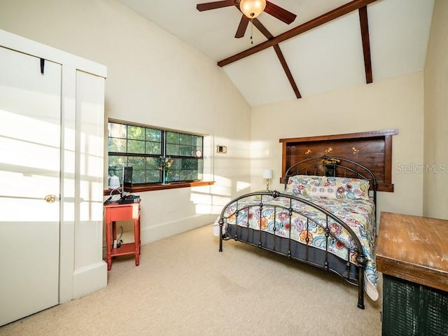 bedroom with carpet, high vaulted ceiling, and beam ceiling