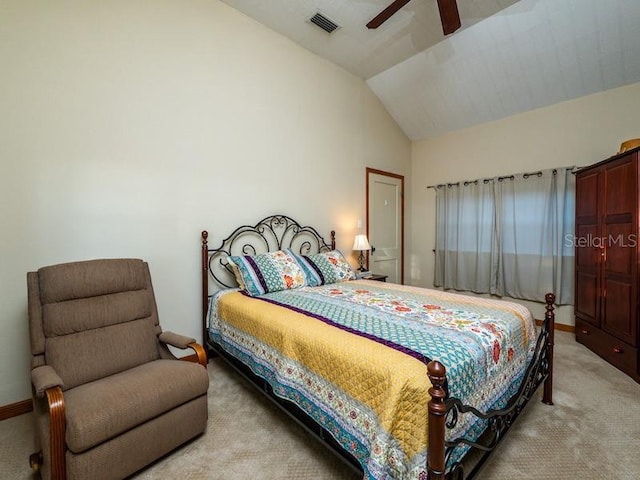 bedroom featuring lofted ceiling, light colored carpet, a ceiling fan, baseboards, and visible vents