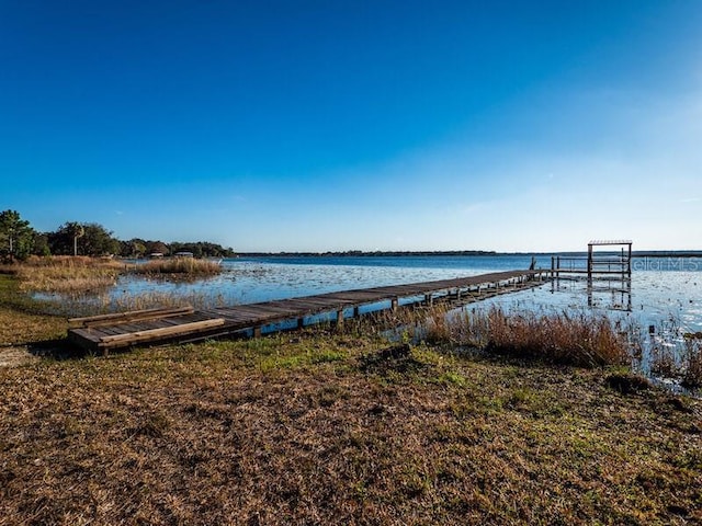 dock area featuring a water view