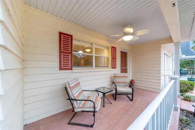 balcony featuring a porch and a ceiling fan