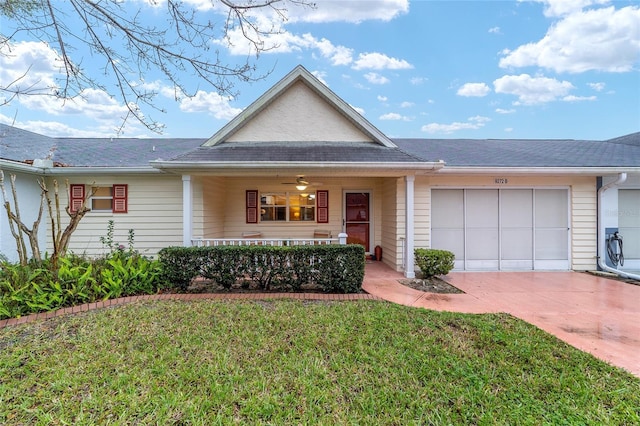 view of front of home featuring a front yard, decorative driveway, and an attached garage