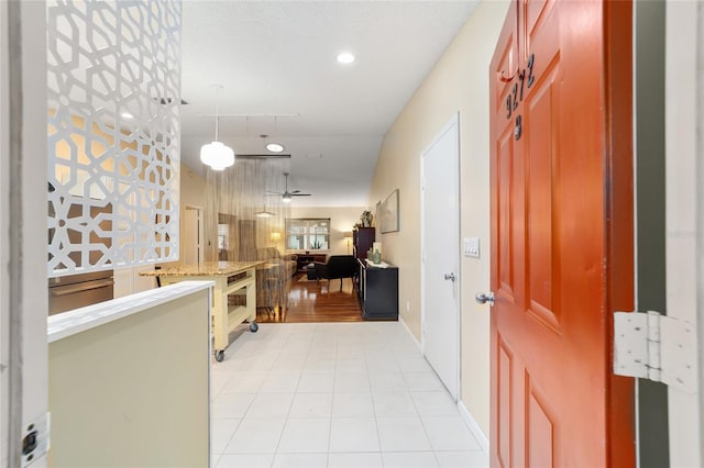 interior space with recessed lighting, ceiling fan, and light tile patterned floors