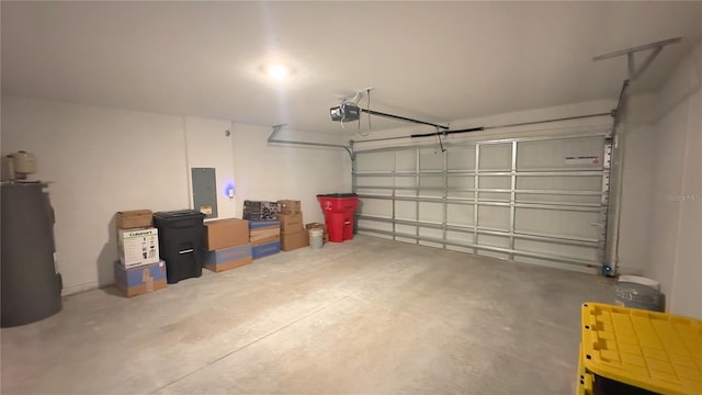 garage with electric panel, water heater, and a garage door opener