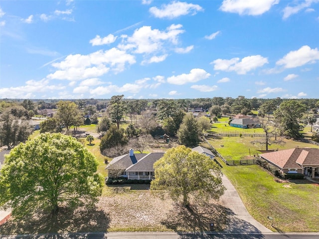 birds eye view of property with a rural view