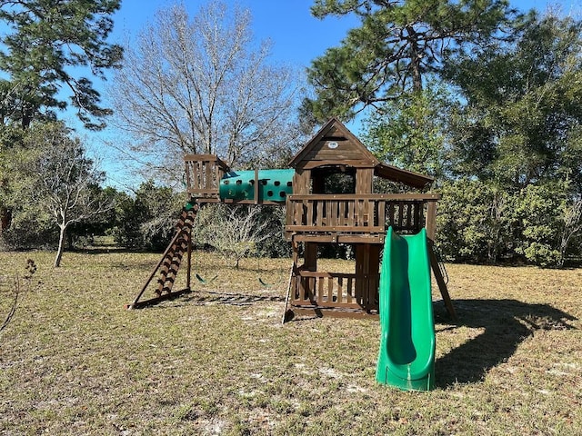 view of playground with a lawn