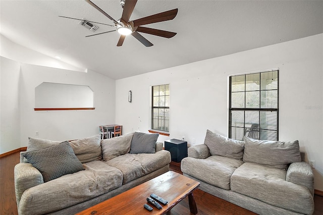 living room featuring lofted ceiling, ceiling fan, wood finished floors, visible vents, and baseboards