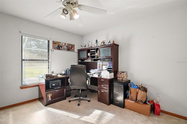 home office featuring a ceiling fan and baseboards