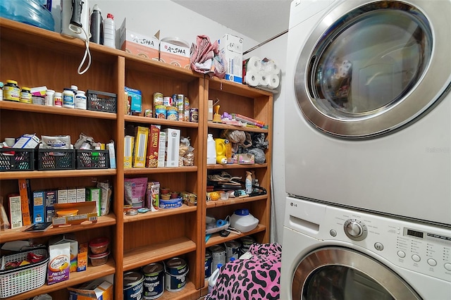 washroom with laundry area and stacked washer / dryer