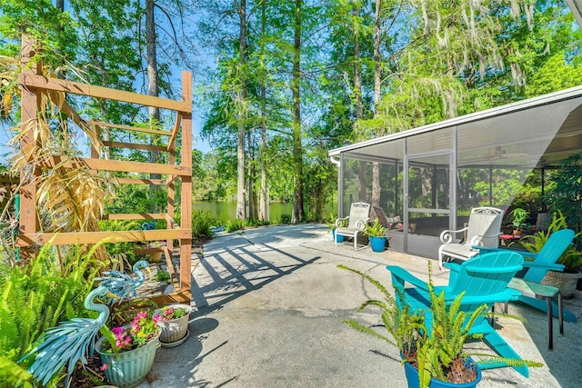 view of patio featuring a sunroom