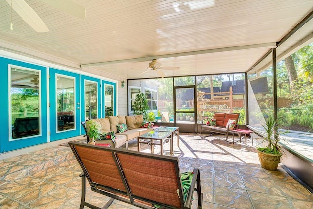 sunroom with a ceiling fan