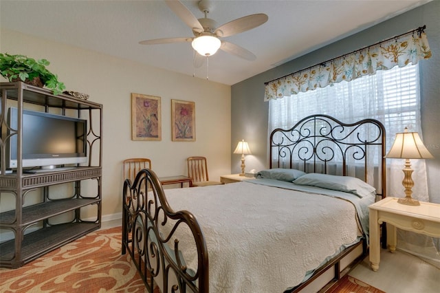 bedroom featuring a ceiling fan and light wood finished floors