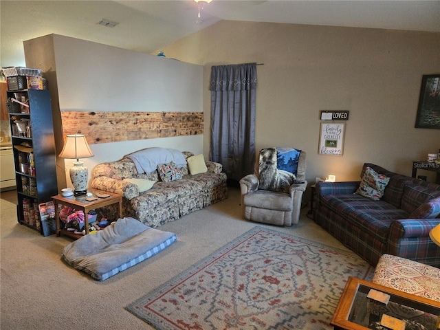 living area with vaulted ceiling, carpet flooring, and visible vents