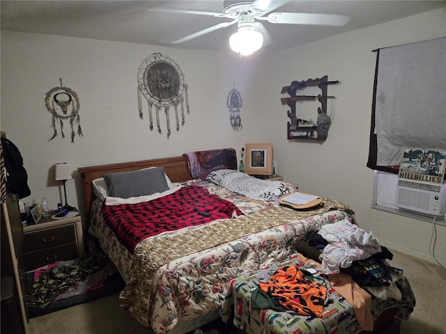 carpeted bedroom with baseboards, a ceiling fan, and cooling unit