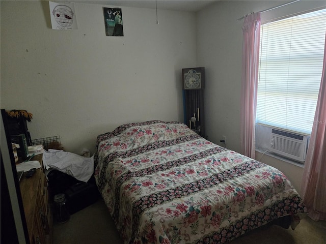 bedroom featuring multiple windows and cooling unit