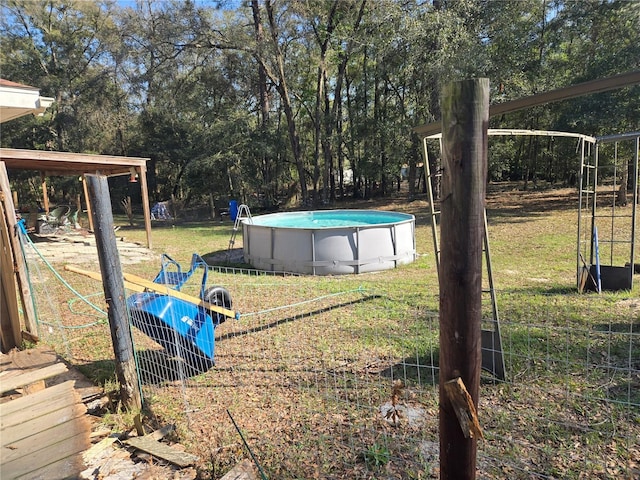 view of yard with an outdoor pool