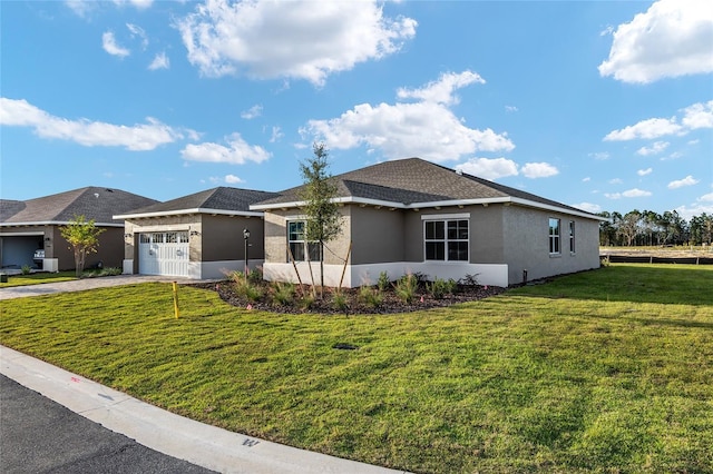 single story home with a garage, a front yard, driveway, and stucco siding