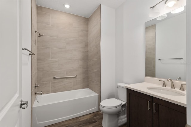 full bath with toilet, vanity, shower / tub combination, and wood finished floors