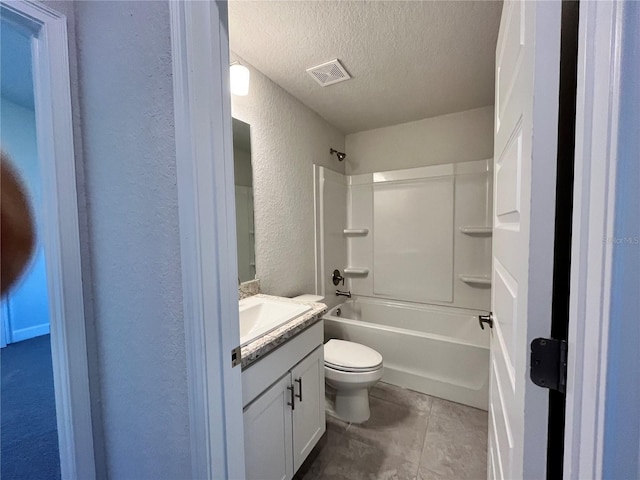 bathroom with visible vents, a textured wall, toilet, a textured ceiling, and vanity