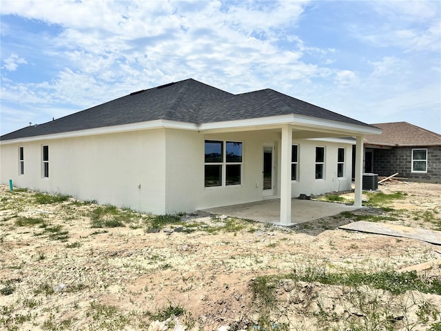 4381 SW 90th Pl, Ocala, FL 34476 - rear view of property with a patio area, roof with shingles, and stucco siding