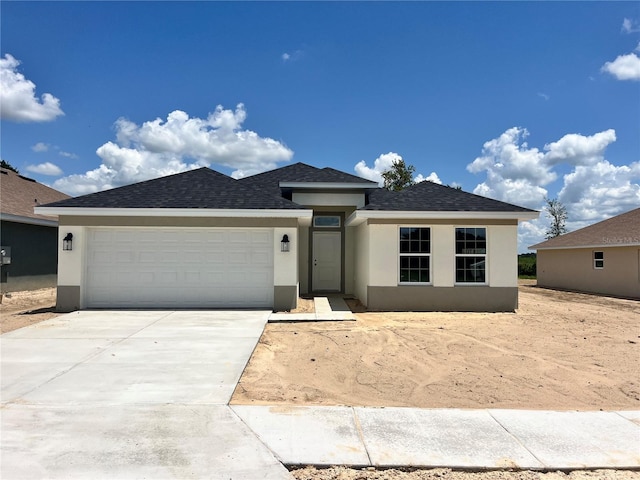 4381 SW 90th Pl, Ocala, FL 34476 - view of front of property with stucco siding, driveway, roof with shingles, and an attached garage