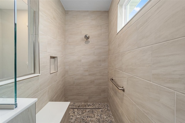 full bathroom with a tile shower